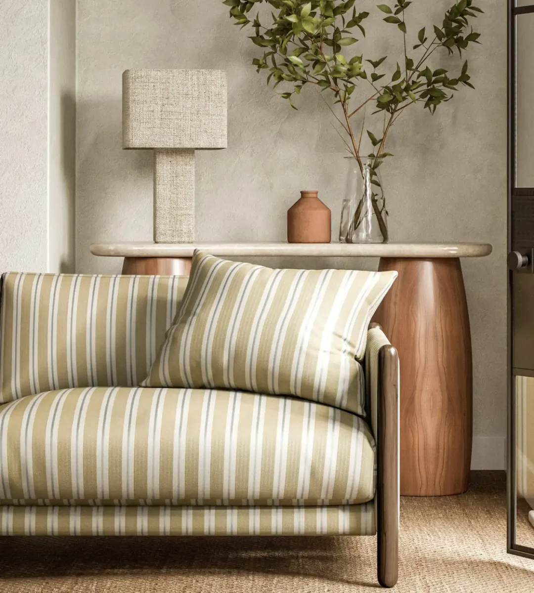 Melton Stripe Fabric - Sand by yellow striped sofa with side table and lamps