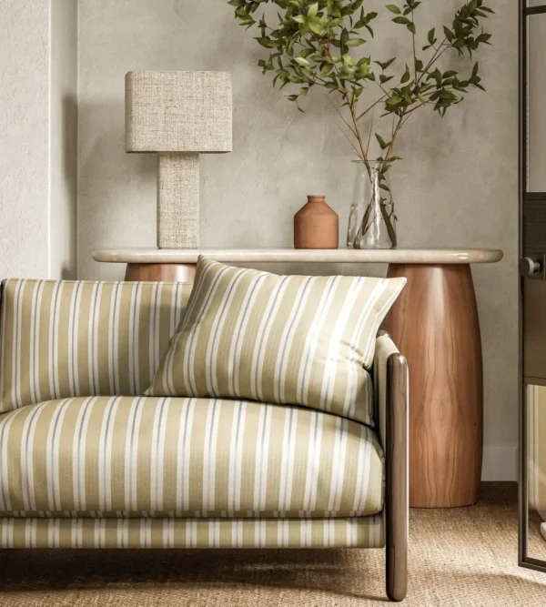 Melton Stripe Fabric - Sand by yellow striped sofa with side table and lamps