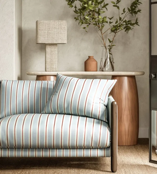 Melton Stripe Fabric - Coast Blue by blue striped sofa with side table and lamps