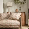 red misc sofa with side table and lamps