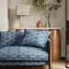blue misc sofa with side table and lamps