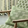 green misc cushion with armchair