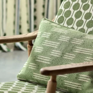 green misc cushion with armchair