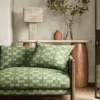 green misc sofa with side table and lamps