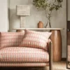 red striped sofa with side table and lamps