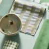green striped fabric with vases