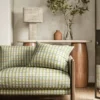 green striped sofa with side table and lamps
