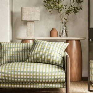 green striped sofa with side table and lamps