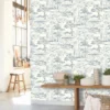 blue botanical wallpaper and wall with wooden bench and vases