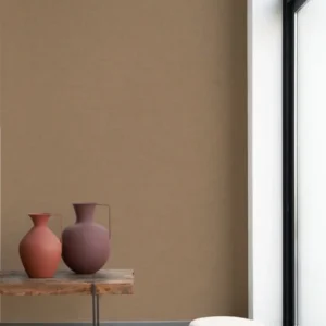 brown plain wallpaper and pouf with vases