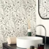 white botanical wallpaper and cabinets with