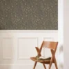 brown botanical wallpaper and chair with