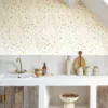 white botanical wallpaper and cabinets with