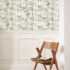 black-grey botanical wallpaper and wall with chair