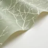 green botanical wallpaper and wall with cabinets and vases