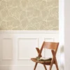 neutral botanical wallpaper and wall with chair