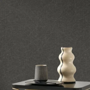black-grey plain wallpaper and wall with armchair and side table
