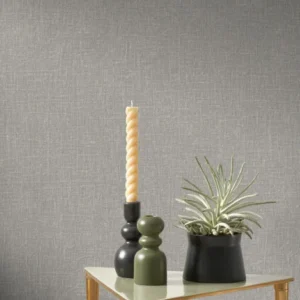 black-grey plain wallpaper and wall with armchair and side table
