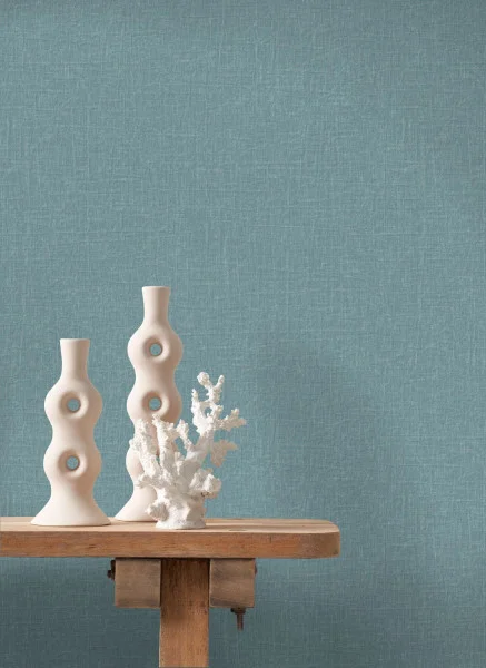 Java Wallpaper - Bleu Lagune by blue plain wallpaper and wall with side table and vases