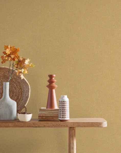 Java Wallpaper - Jaune Safran by yellow plain wallpaper and wall with side table and vases