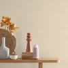 white plain wallpaper and wall with side table and vases