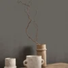 black-grey plain wallpaper and wall with side table and vases