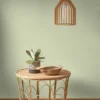 green plain wallpaper and wall with side table and lamps