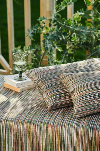 Averno Fabric - Bleu Ocre by orange striped sofa with cushion and vases