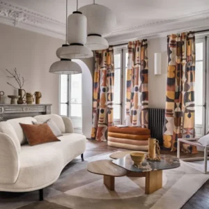 blue geometric curtain with sofa and coffee table