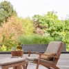 blue plain armchair with coffee table and vases