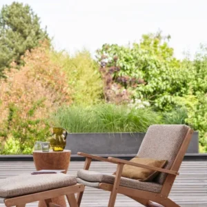 blue plain armchair with coffee table and vases