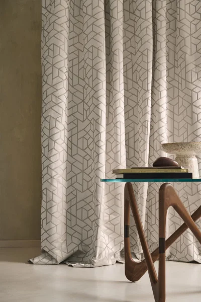 Premiere Loge Fabric - Orange Brulee by white geometric curtain with coffee table and vases