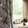 green botanical curtain with cushion and vases