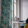 blue botanical curtain with chair and vases