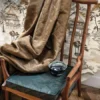neutral misc chair with curtain and vases