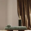 white plain curtain with pouf and vases