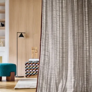 neutral striped curtain with pouf and lamps