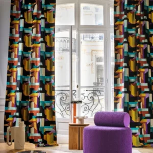black-grey geometric curtain with pouf and coffee table