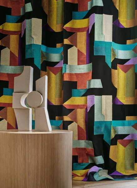 Polychromie Fabric - Topaze Ultraviolet by black-grey geometric curtain with side table