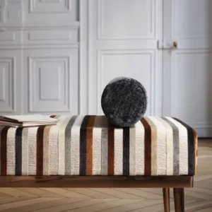 multicolour striped bed with cushion and cabinets