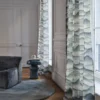 neutral misc sofa with curtain and side table