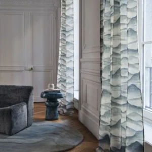 neutral misc sofa with curtain and side table