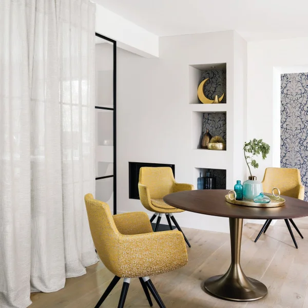 Conti Fabric - Champagne by green plain curtain with armchair and dining table