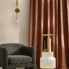 neutral geometric curtain with armchair and vases