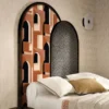 green geometric bed with cushion and pouf