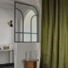 neutral striped curtain with coffee table and vases