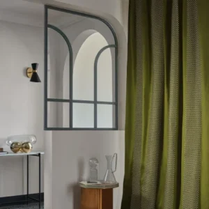 neutral striped curtain with coffee table and vases