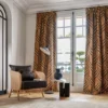 orange geometric curtain with armchair and coffee table