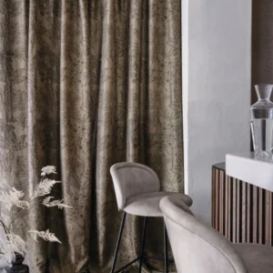 black-grey botanical curtain with armchair and vases