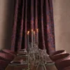 neutral botanical curtain with dining table and armchair